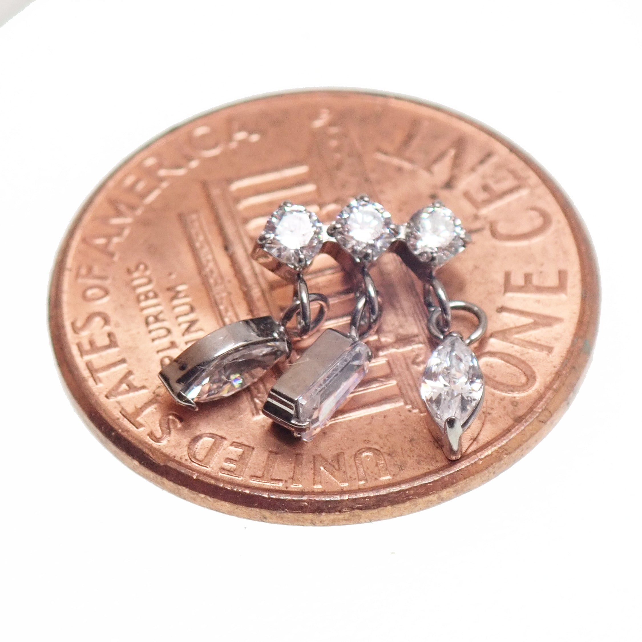 Body Clickers implant titanium dangle CZ cluster flatback piercing with penny design in 14g, 16g, and 18g sizes.