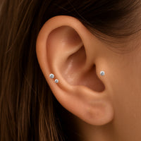 Set of three Body Clickers PVD gold titanium internally threaded labret studs in 16G flatback piercing style.