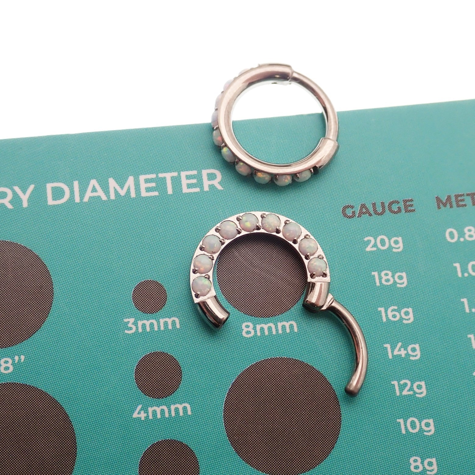 8mm chunky opal titanium hinged clicker hoop earring in 16 gauge from Body Clickers, showcasing the vibrant opal gemstone.