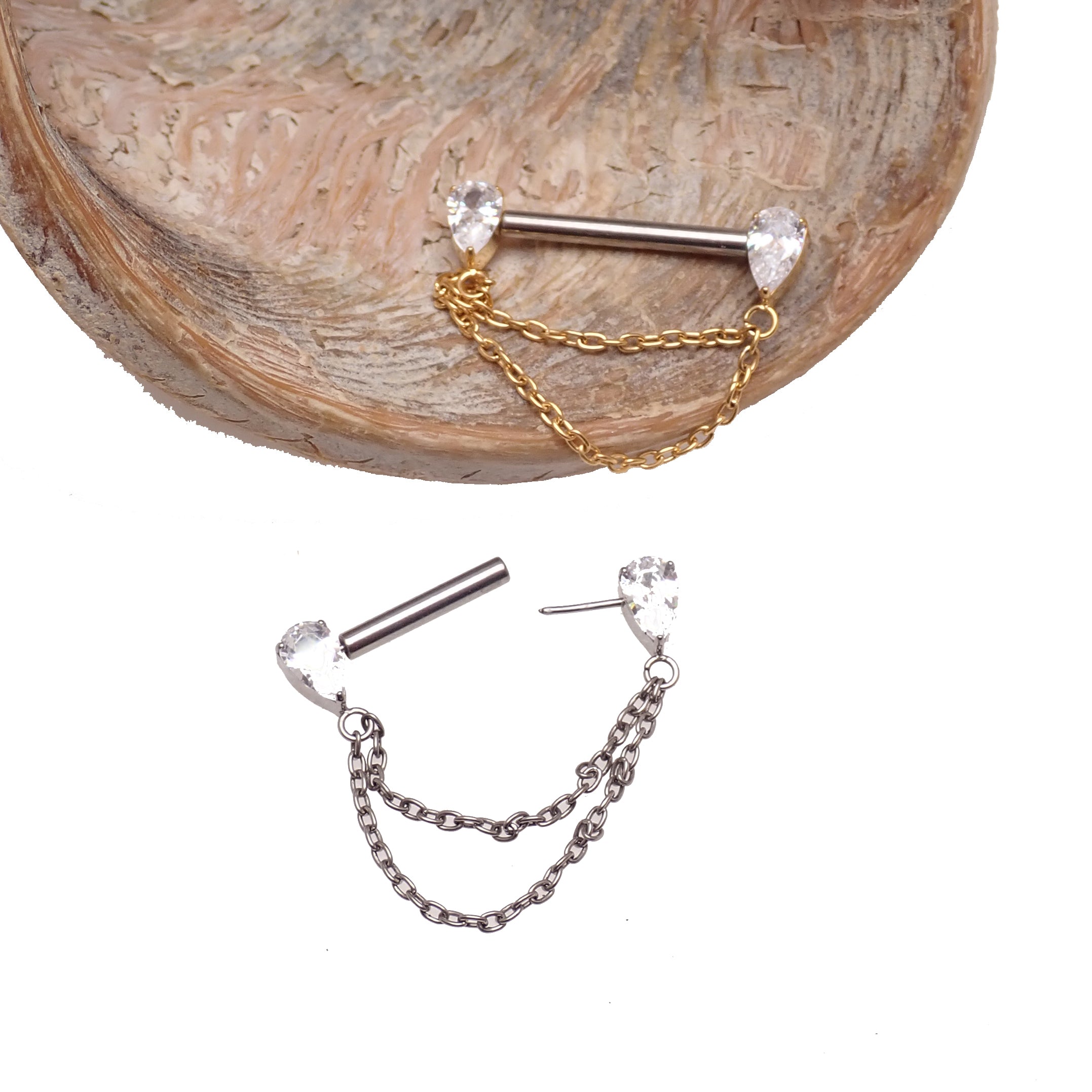 Gold CZ double chain titanium nipple bar piercing by Body Clickers, available in 16g, 14g, and 12g gauges with 12mm chain.