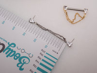 Gold titanium CZ double chain nipple bar piercing by Body Clickers, available in 12g, 14g, and 16g gauges with 12mm chain links.