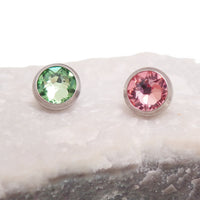 Pink or green CZ dermal top by Body Clickers, titanium round implant with 14g, 1.2mm threaded design for body jewelry.