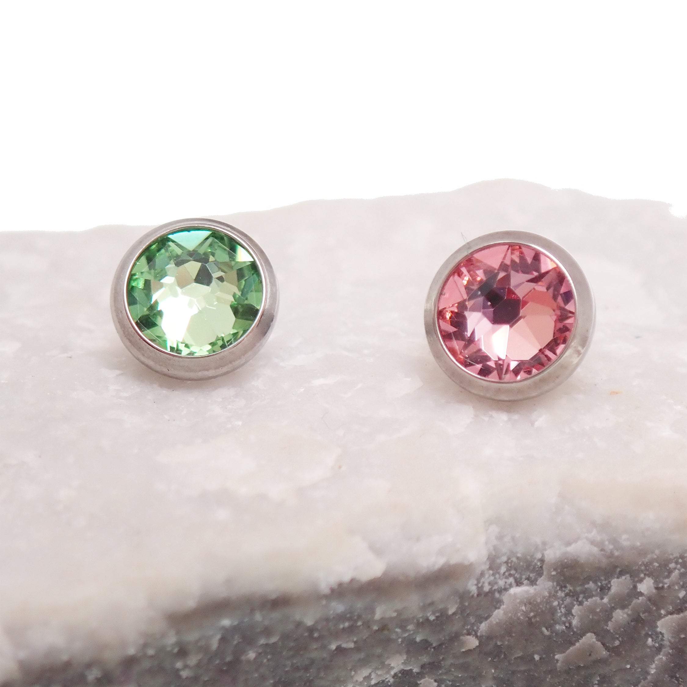 Pink or green CZ dermal top by Body Clickers, titanium round implant with 14g, 1.2mm threaded design for body jewelry.