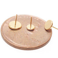 Titanium flat back body piercing with 3mm 24K gold PVD finish and threadless flat disc top from Body Clickers.