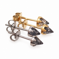 A pair of silver and gold tourmalated quartz earrings on a white background 