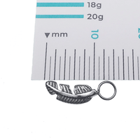 Halobes bird feather titanium charm for earrings, fits up to 10g hoops, lightweight and stylish jewelry accessory.