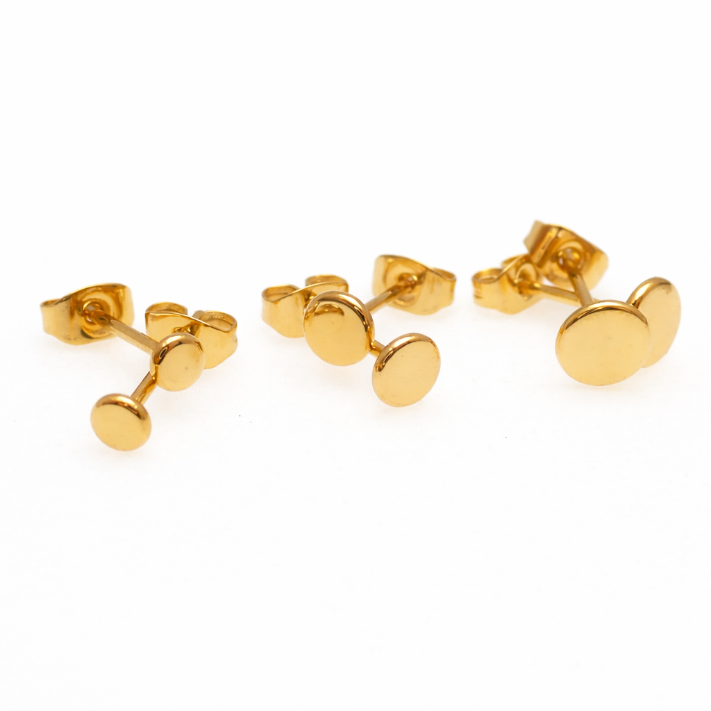 Pair of Halobes PVD gold flat disc titanium stud earrings in 3mm, 4mm, and 5mm sizes, with a sleek, minimalist design.