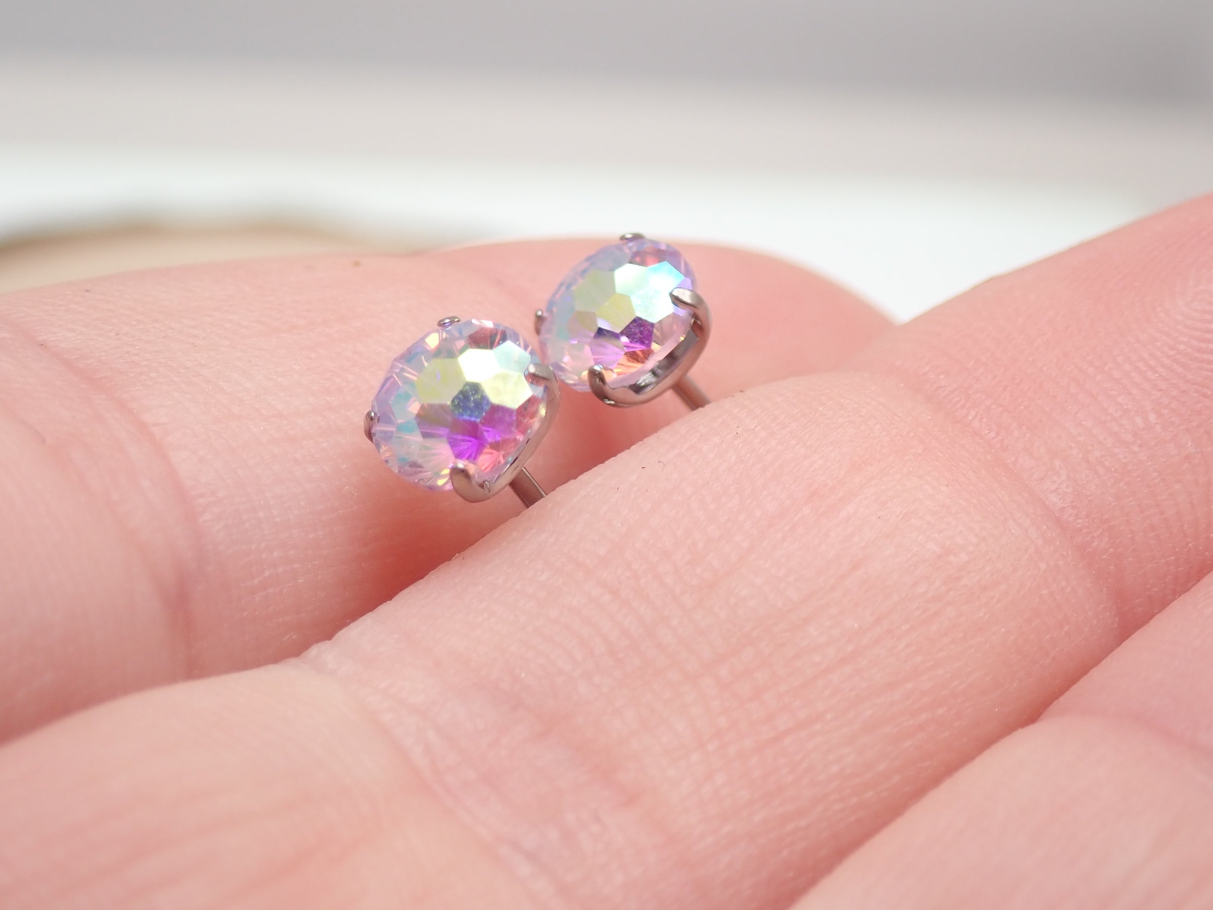 Halobes CZ Mermaid Lavender Titanium Earrings pair, featuring elegant mermaid design in lavender titanium, showcasing detailed craftsmanship.