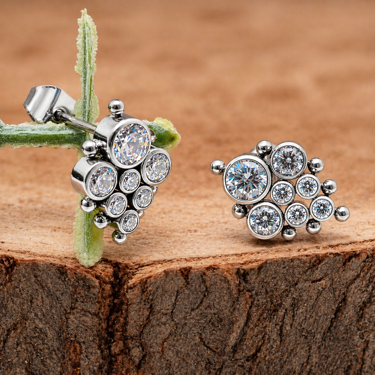 Pair of HALOBES implant titanium CZ earrings, 20g gauge, featuring sparkling cubic zirconia stones and a sleek, modern design.