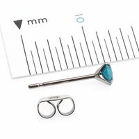 Pair of turquoise 4mm titanium stud earrings with claw setting, from Halobes, featuring a sleek and modern jewelry design.