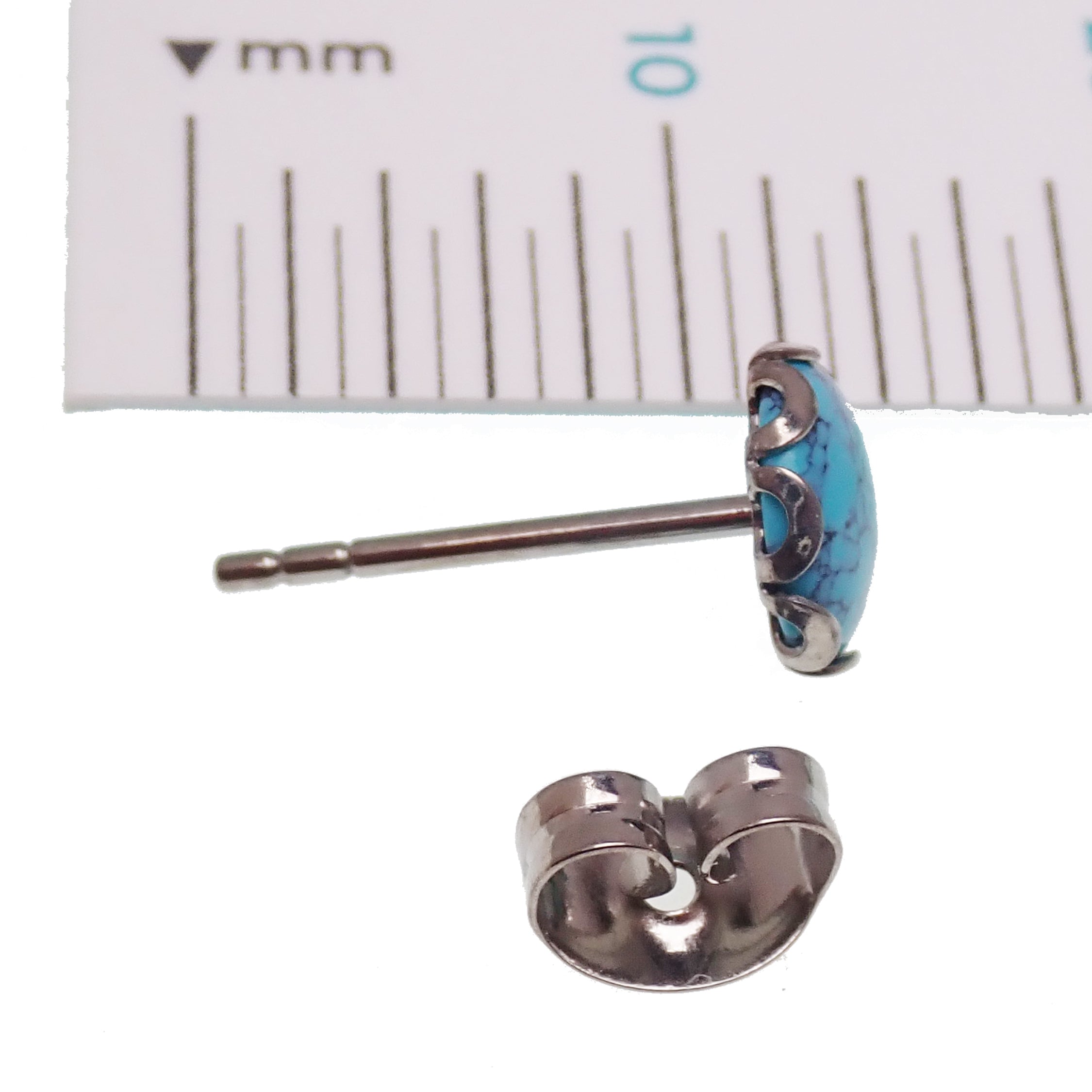 Pair of turquoise 6mm titanium stud earrings from Halobes, lightweight 20g earrings with a sleek, modern design.