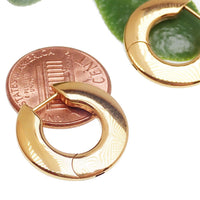Pair of Body Clickers titanium silhouette huggie earrings with hinged clickers, 10mm size, in gold tone, 20g weight, shown in PVD gold finish.