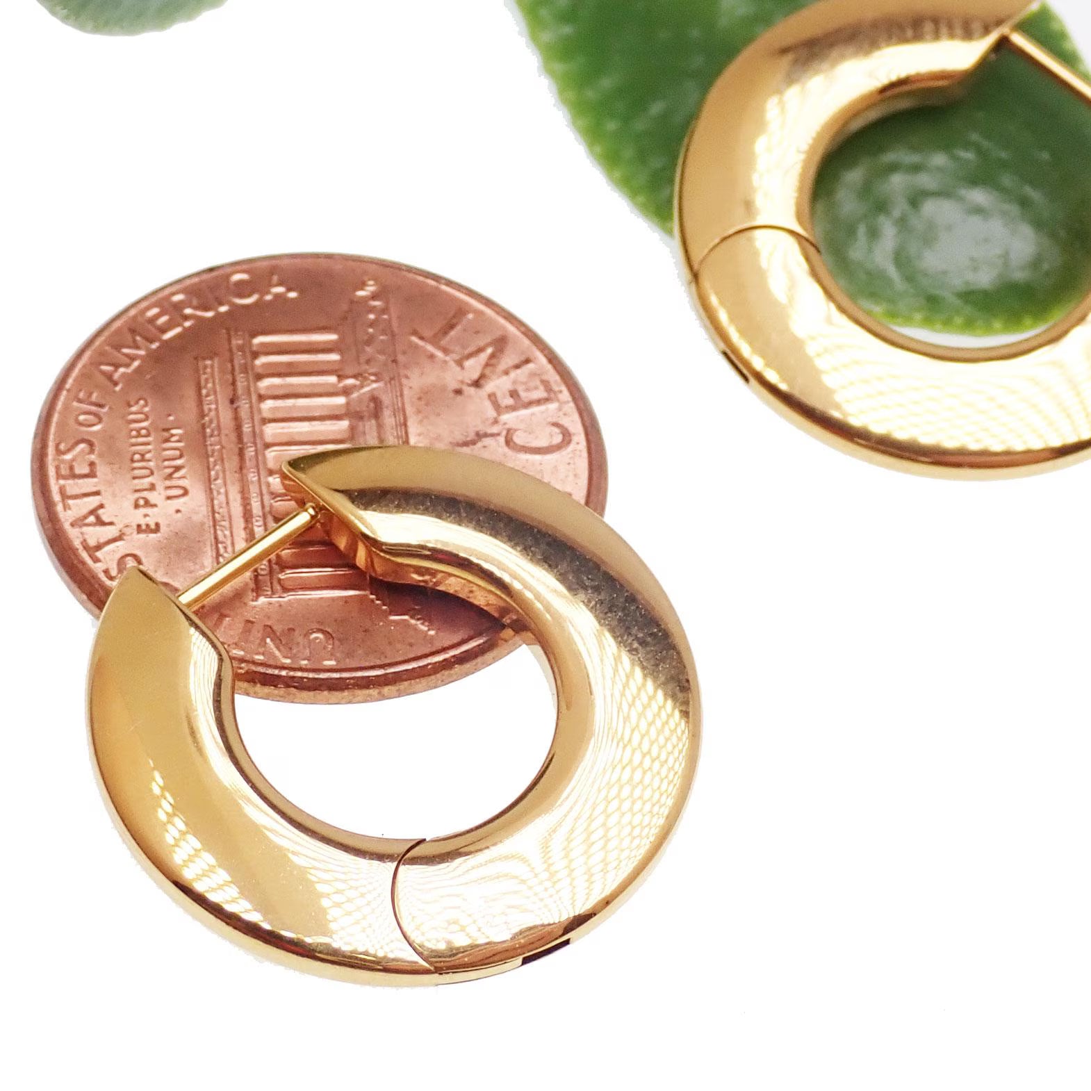 Pair of Body Clickers titanium silhouette huggie earrings with hinged clickers, 10mm size, in gold tone, 20g weight, shown in PVD gold finish.