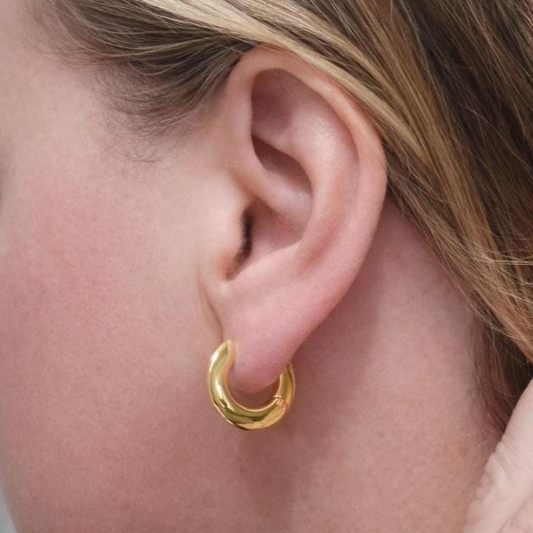 Pair of Body Clickers titanium silhouette huggie earrings with hinged clickers, 20g 10mm size, shown in a real ear.