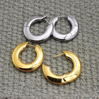 Pair of implant titanium silhouette huggie earrings by Body Clickers, hinged clicker style in silver and gold, 10mm size, 20g weight