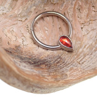 16g natural stone garnet titanium clicker earring by Magpie featuring vibrant red garnet stones and sleek titanium design