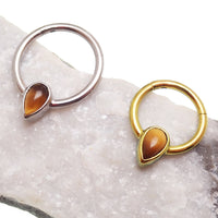 Magpie 16g natural stone tiger's eye titanium clicker, teardrop-shaped body for body piercing jewelry.