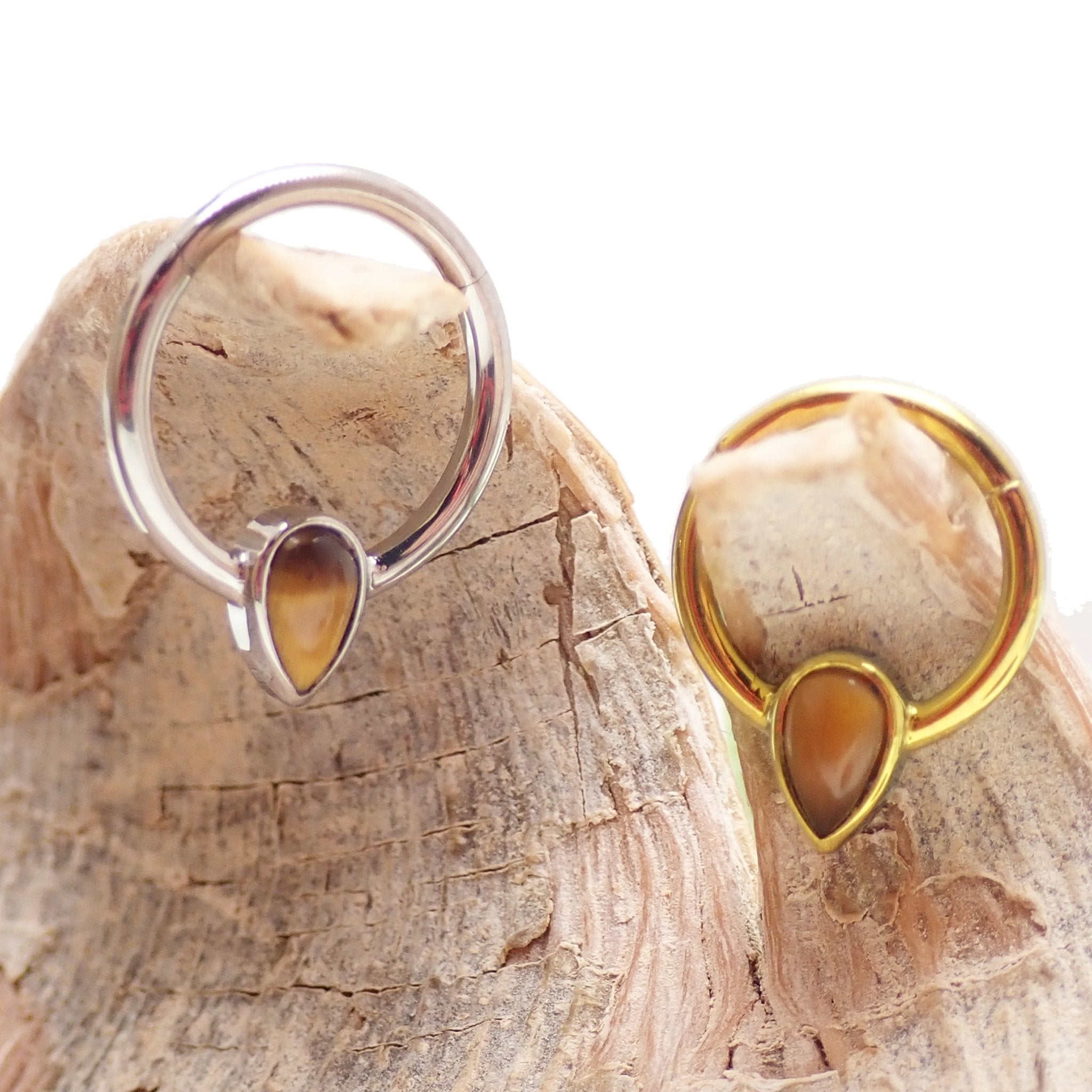 Magpie 16g natural stone tiger's eye titanium clicker with teardrop shape for body piercing jewelry.