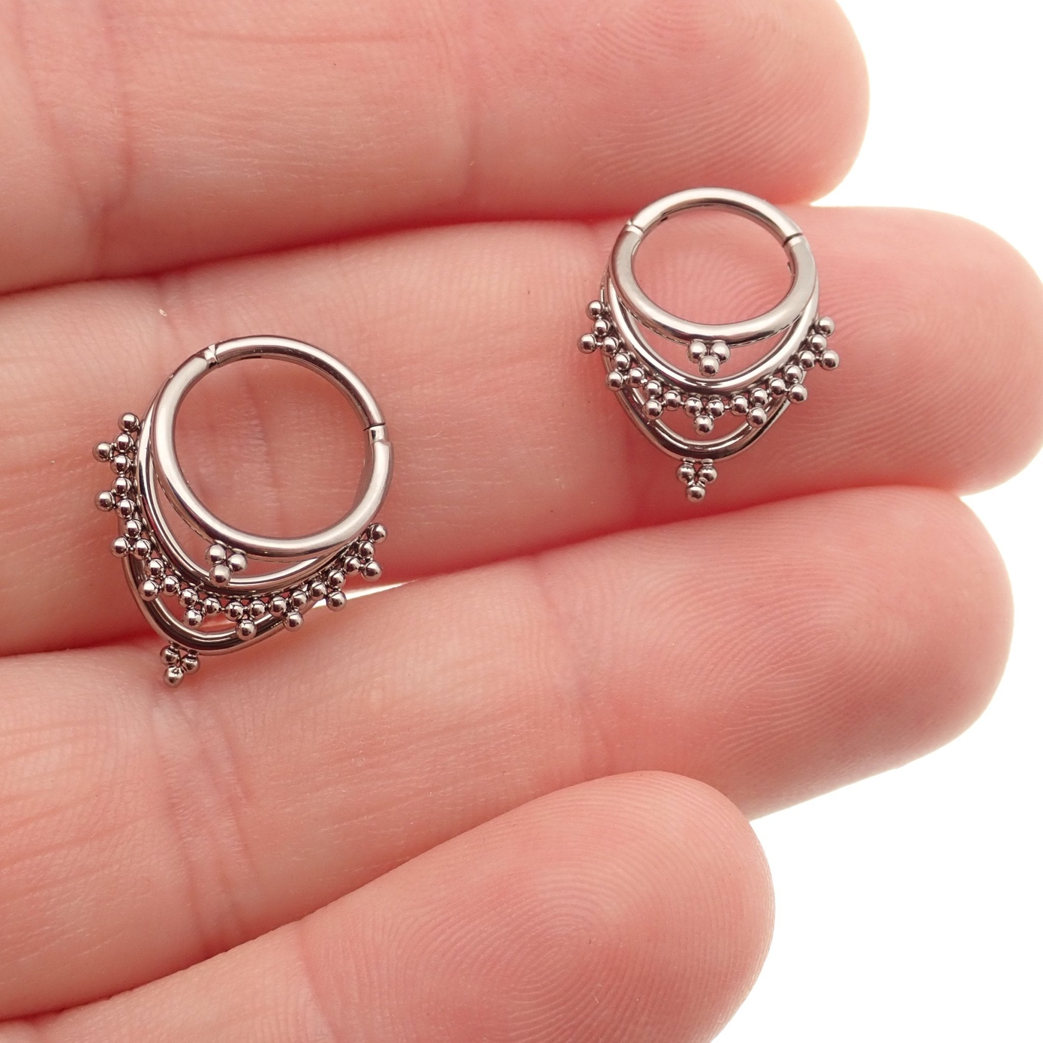 Magpie 16g titanium 3-tier fan out septum clicker in 8mm and 10mm with beaded design, showcasing multiple tiers and intricate details.