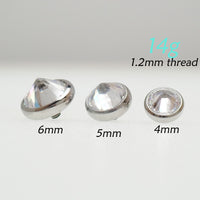 Magpie internally threaded 14g CZ top attachment with 1.2mm thread, displayed on a jewelry display.