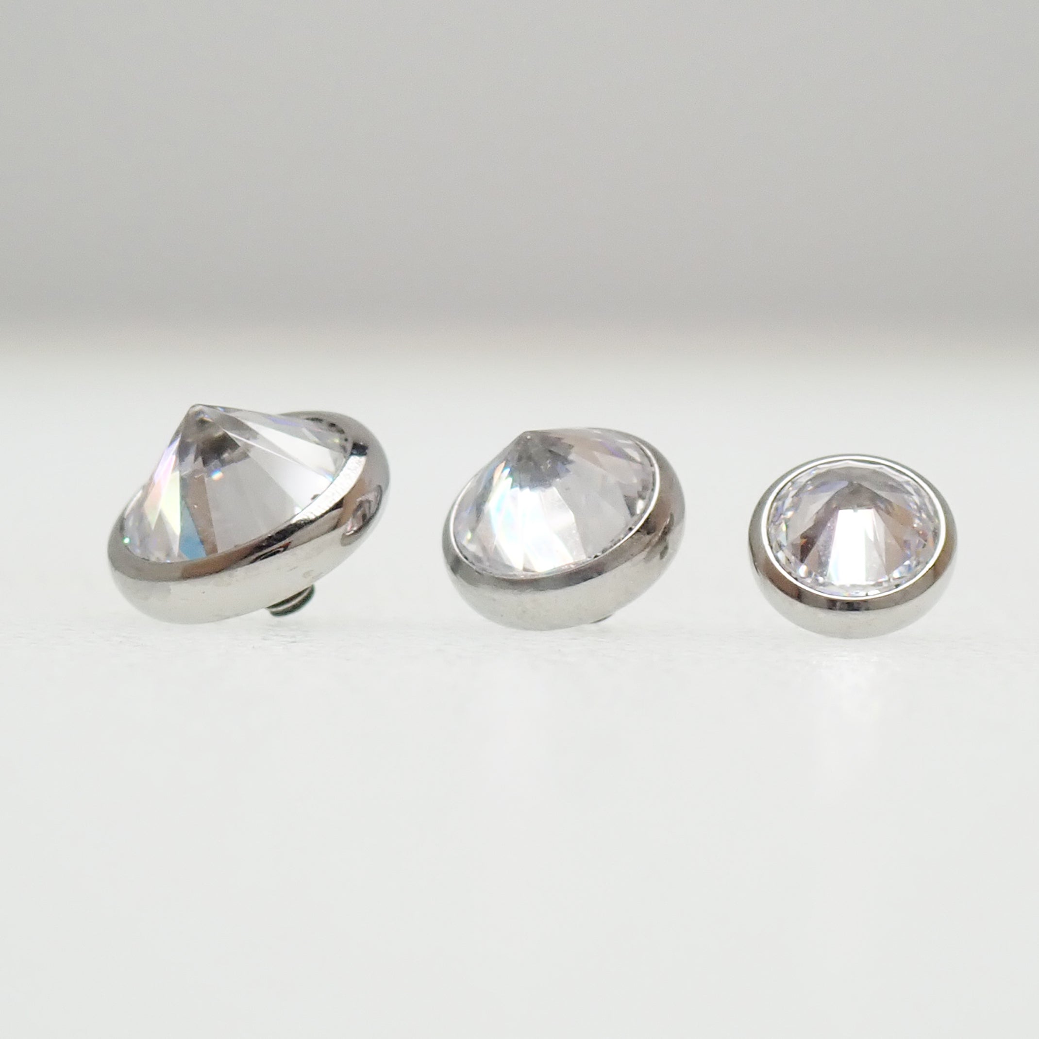 Magpie 14g internally threaded dermal attachment with 1.2mm CZ top for body piercing jewelry.