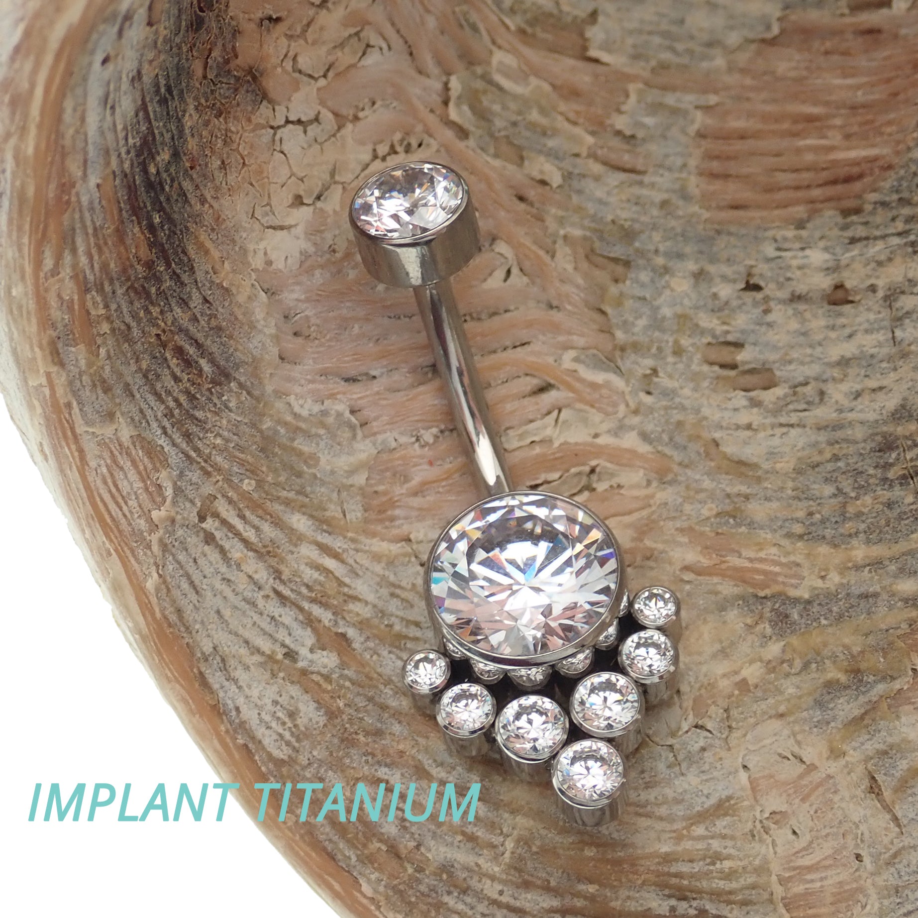 Magpie CZ titanium belly ring, 10mm to 12mm, featuring a sleek design and sparkling cubic zirconia stone for a stylish look.