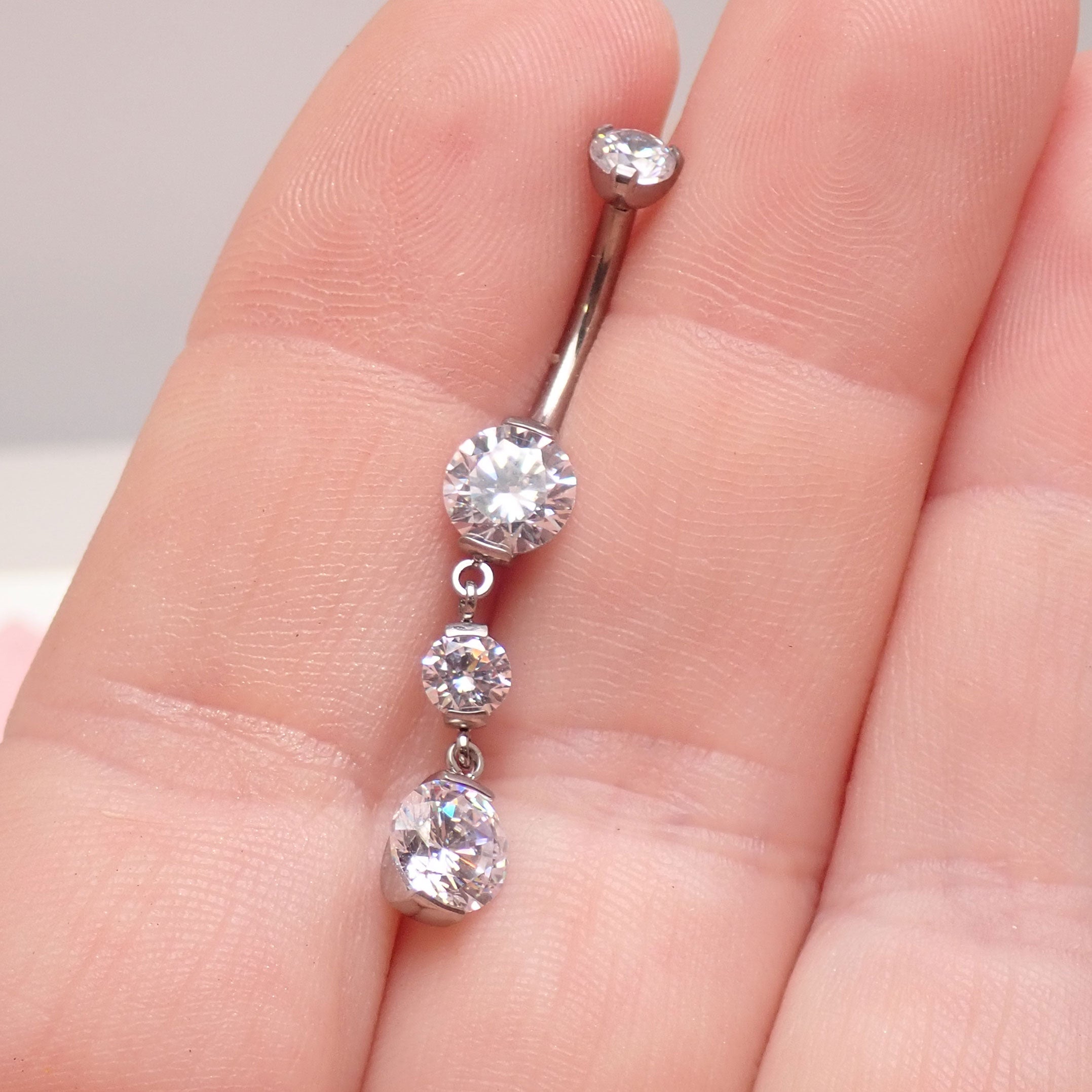Titanium dangly belly ring by Magpie, 14g, 11mm length, with a sleek design for implant piercing.
