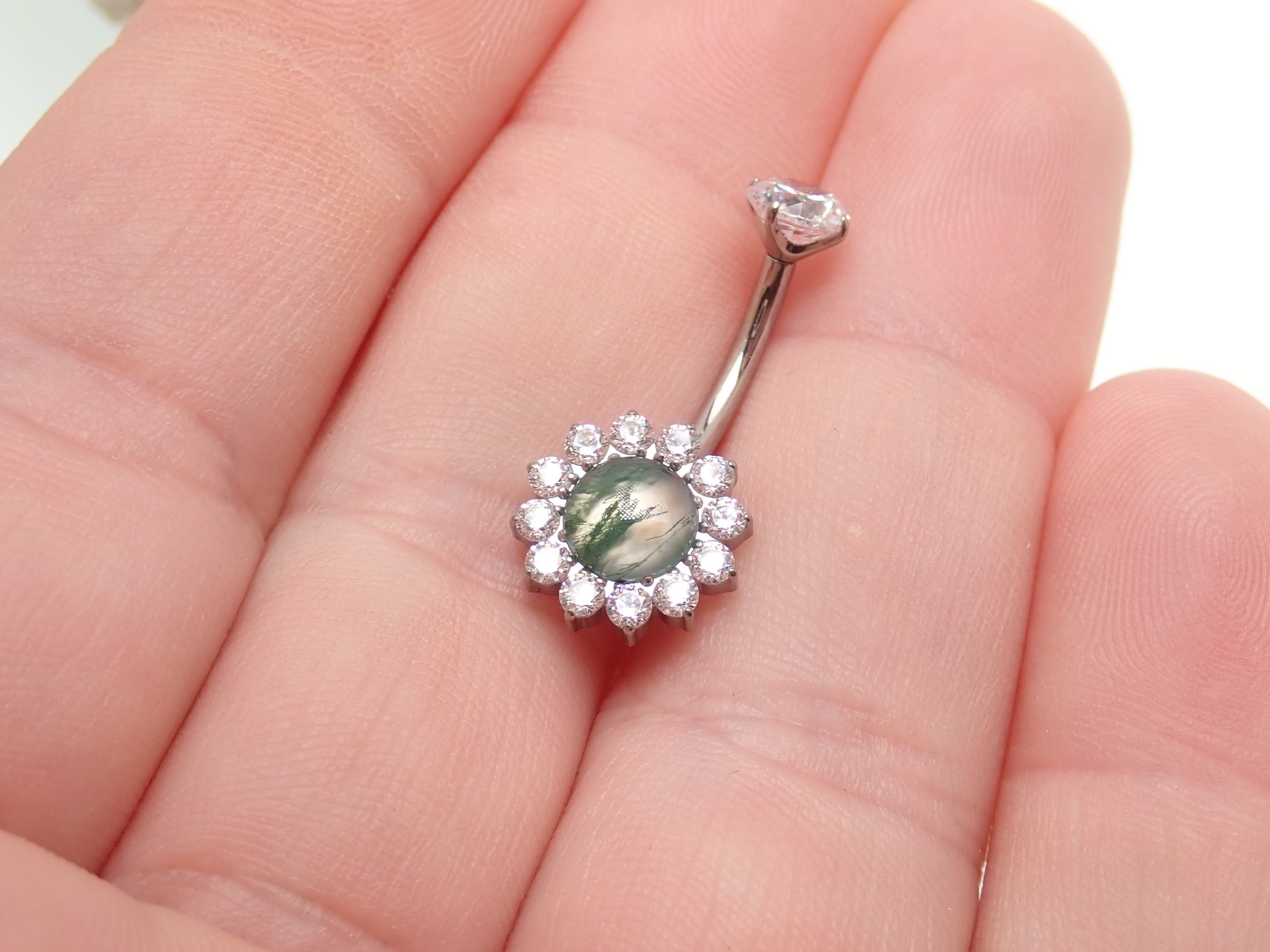 Magpie Moss Agate and cubic zirconia belly ring, 14g, 10mm, with a natural stone and decorative accents.