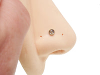 Rutilated Quartz 4mm top internally threaded body jewelry by Magpie, featuring a polished, clear quartz stone.