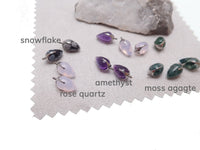 Natural stone bullet cones by Magpie Body Jewelry, 16g/0.9mm thread attachments with amethyst stones.