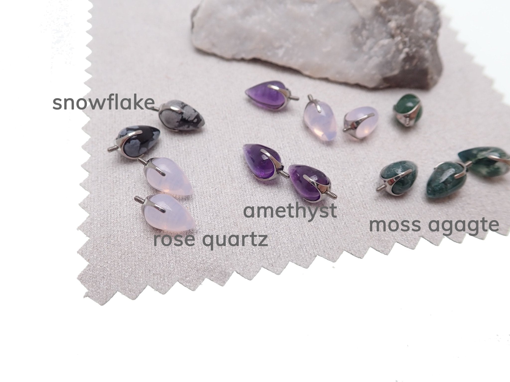 Natural stone bullet cones by Magpie Body Jewelry, 16g/0.9mm thread attachments with amethyst stones.