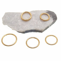 Plain titanium PVD gold clicker hoop by Magpie Body Jewelry, 18g and 16g, featuring a sleek, minimalist design.