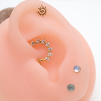 Gold titanium clicker hoop with CZ stones, 16G 8mm size, jewelry by Magpie Body Jewelry featuring sparkling accents.