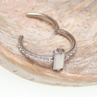 Rectangular white opal CZ titanium clicker jewelry in 16g, 11mm size, by Magpie Body Jewelry, shown on a clean background.