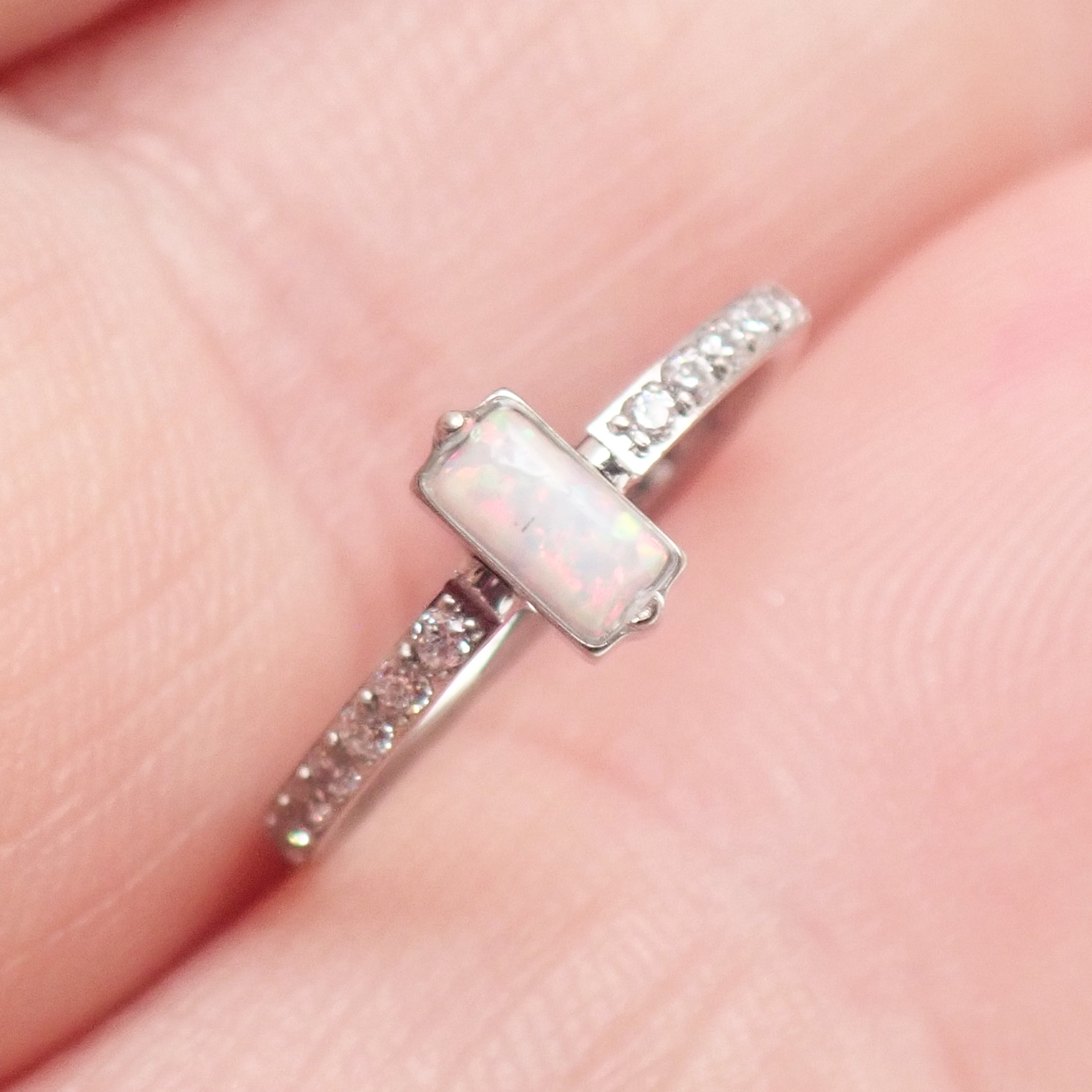Rectangular white opal CZ titanium clicker earring in 16g size with 11mm length, from Magpie Body Jewelry.