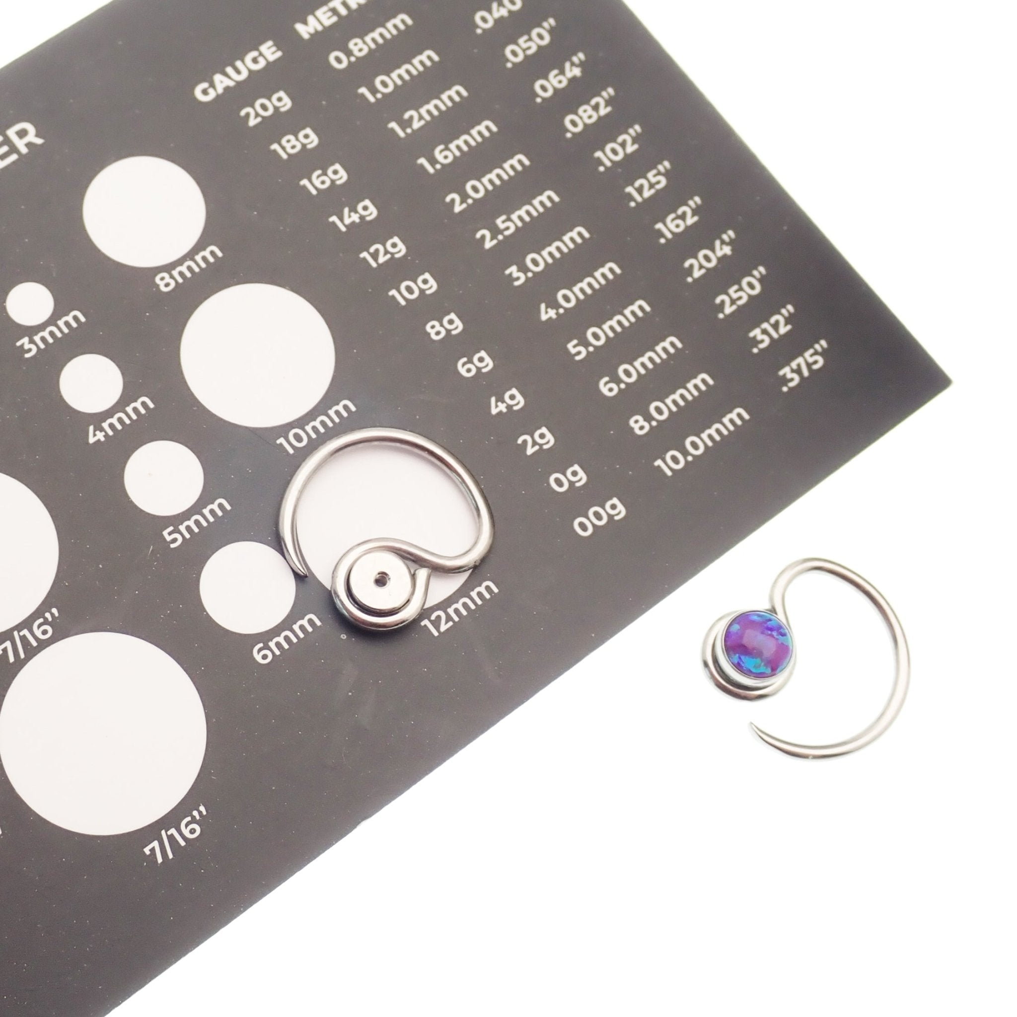 Niobium daith spiral body jewelry in 16g with customizable top design, featuring a sleek and modern look for pierced ears.