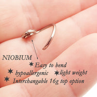 Niobium daith spiral body jewelry in 16g with customizable top design, by Magpie, featuring a sleek spiral shape and smooth finish.