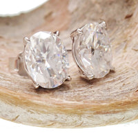 Sterling silver Moissanite oval earrings with certificate, featuring 5x7mm sparkling gemstones and elegant dangle design.