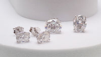 Sterling silver moissanite oval earrings with certificate, 5x7mm size, elegant jewelry by Magpie Body Jewelry.