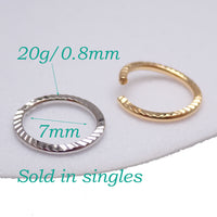 Sterling silver 20G nose hoop ring with a 7mm diameter by Magpie Body Jewelry, suitable for nose piercing.