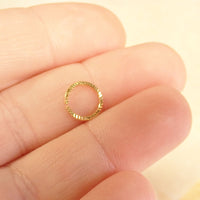 Sterling silver 20G nose hoop ring by Magpie Body Jewelry, 7mm diameter, showcasing a sleek, minimalist design for nose piercing.