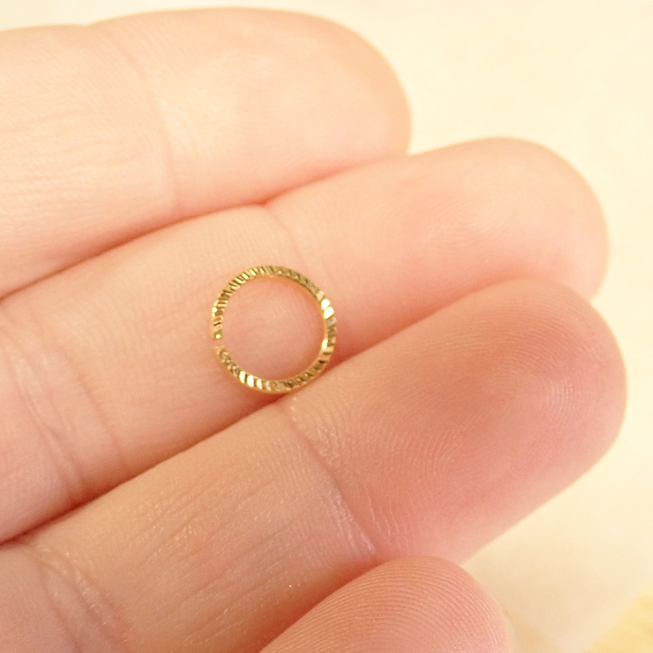 Sterling silver 20G nose hoop ring by Magpie Body Jewelry, 7mm diameter, showcasing a sleek, minimalist design for nose piercing.