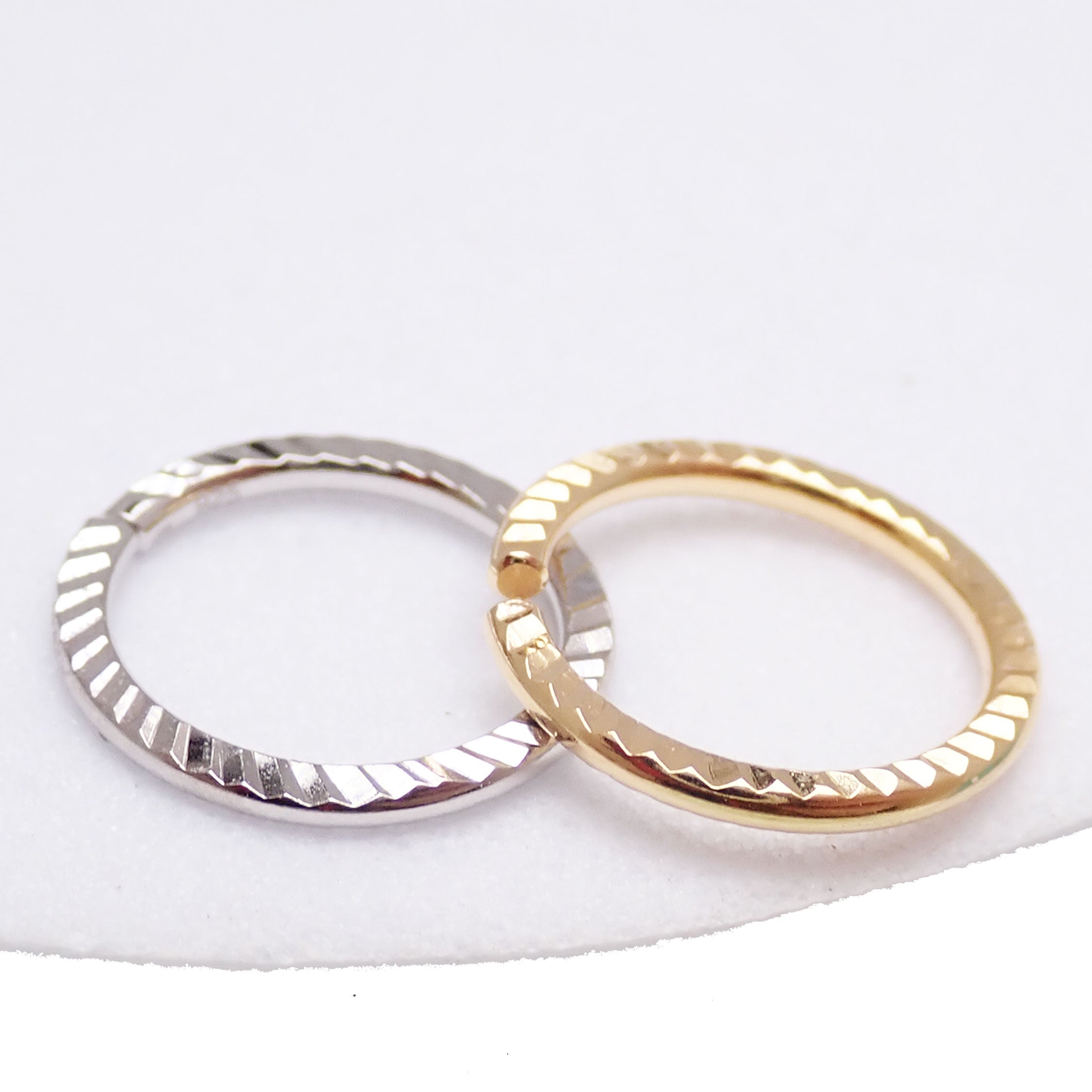 Sterling silver 20G nose hoop ring by Magpie Body Jewelry, 7mm diameter, simple and stylish nose ring accessory.