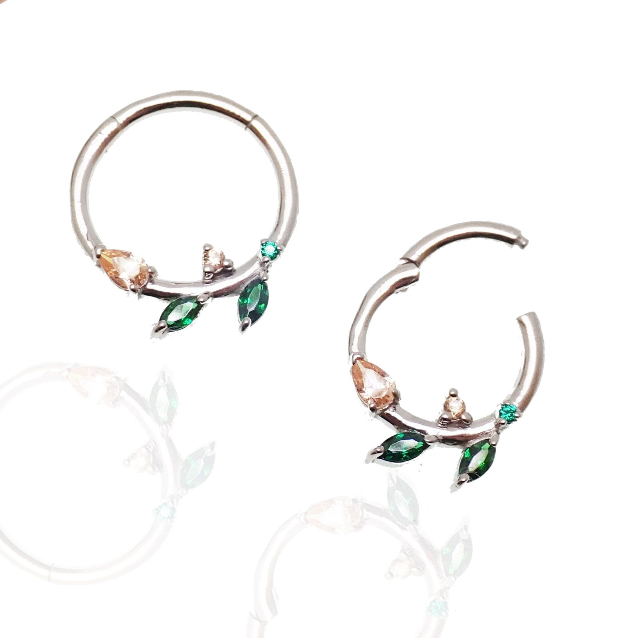 Sterling silver 925 leaf hinged clicker earrings with emerald green cubic zirconia from Magpie Body Jewelry.