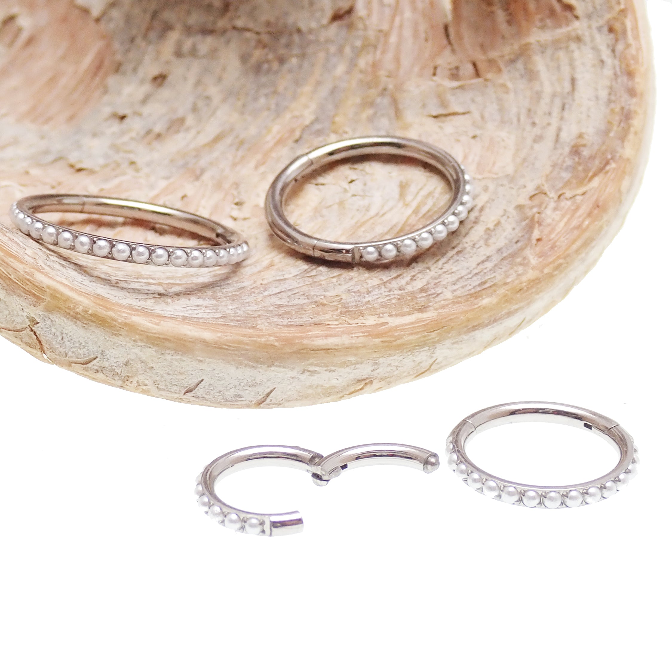 Magpie pearl titanium hinged clicker ring with 6mm pearl and 16g gauge, designed for body piercing jewelry.