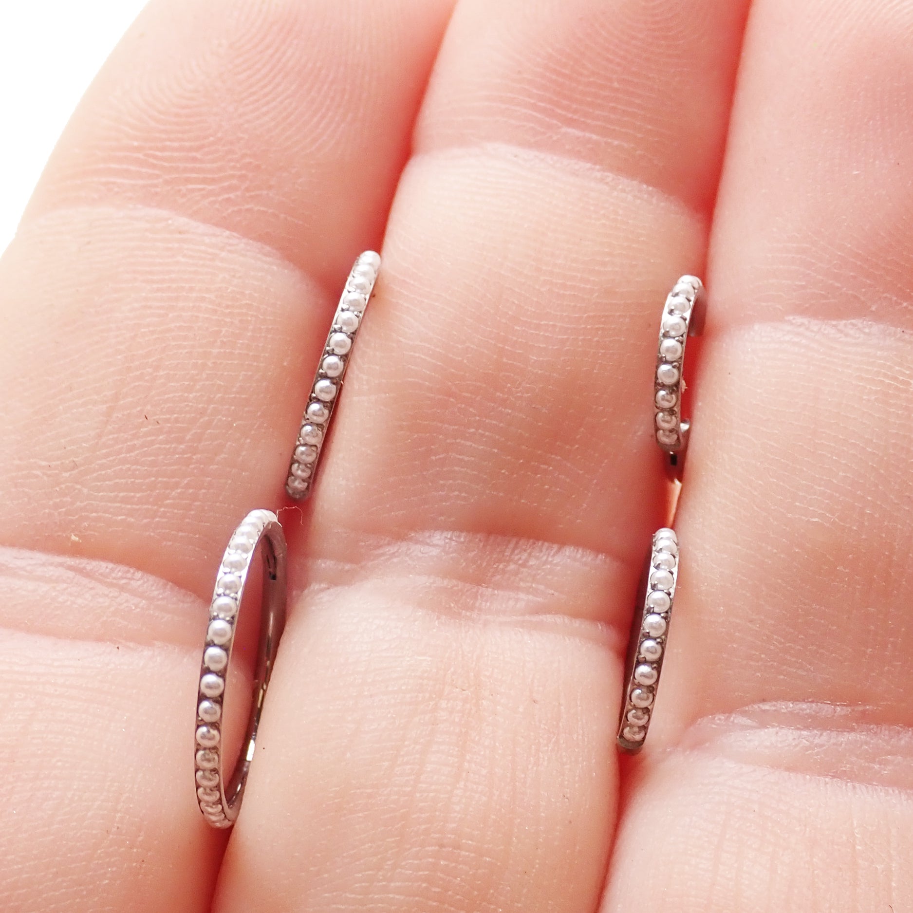 Magpie Pearl Titanium Hinged Clicker Ring 16g, featuring a 6mm pearl accent and sleek design for body piercing jewelry.