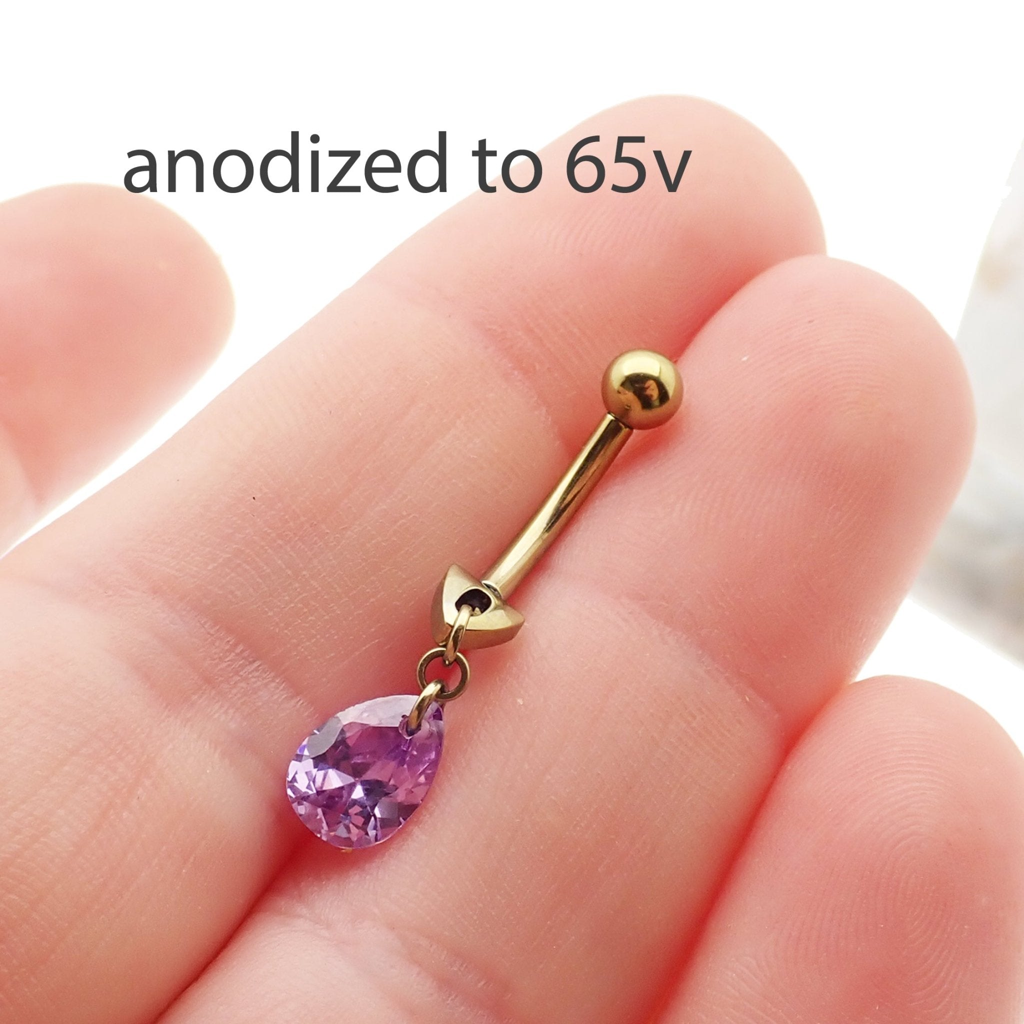 Magpie 14g curve belly ring with a violet dangle and cute design, featuring a curved bar style for belly piercings.