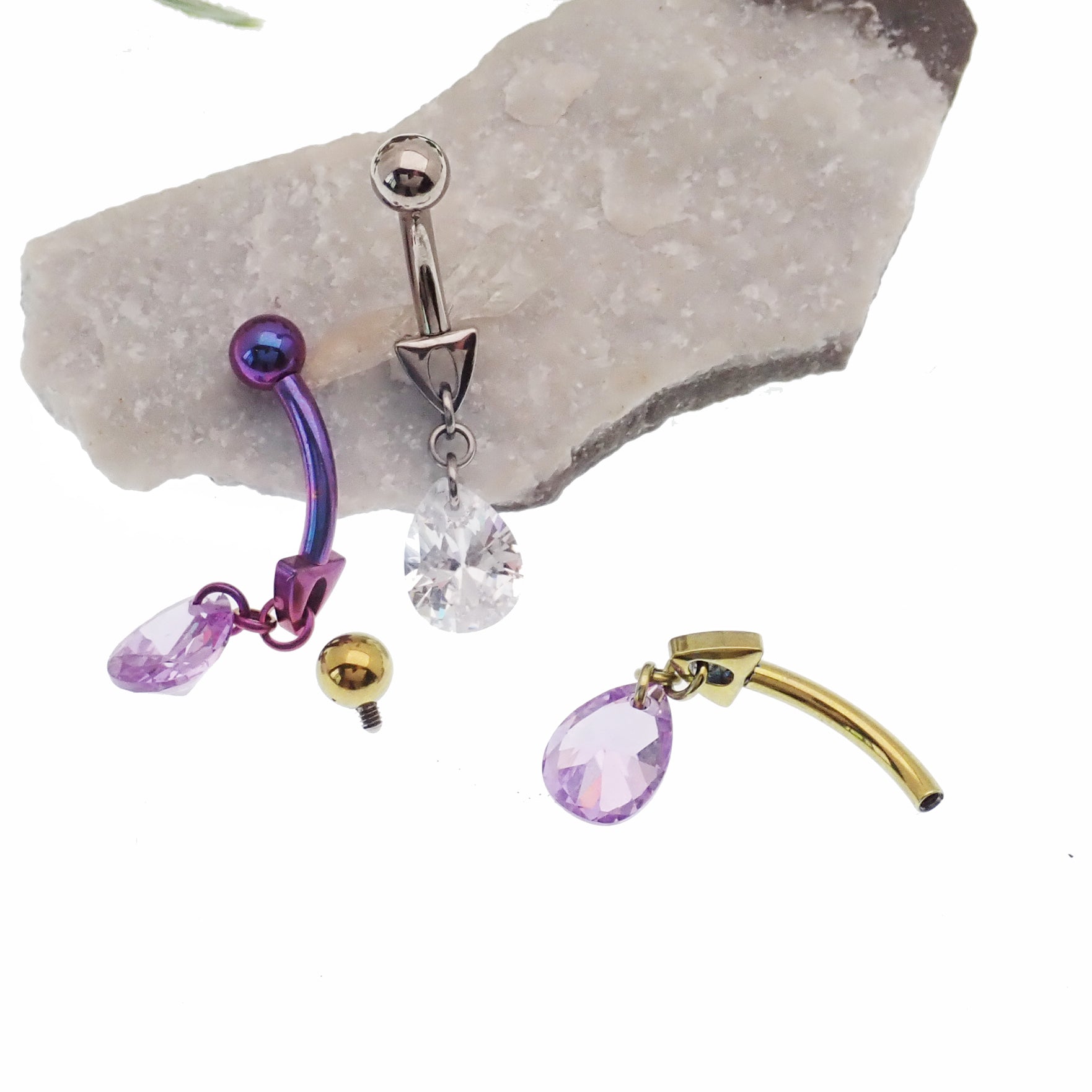 Magpie 14g curve belly ring with violet dangle charm, curved bar design for stylish body jewelry.