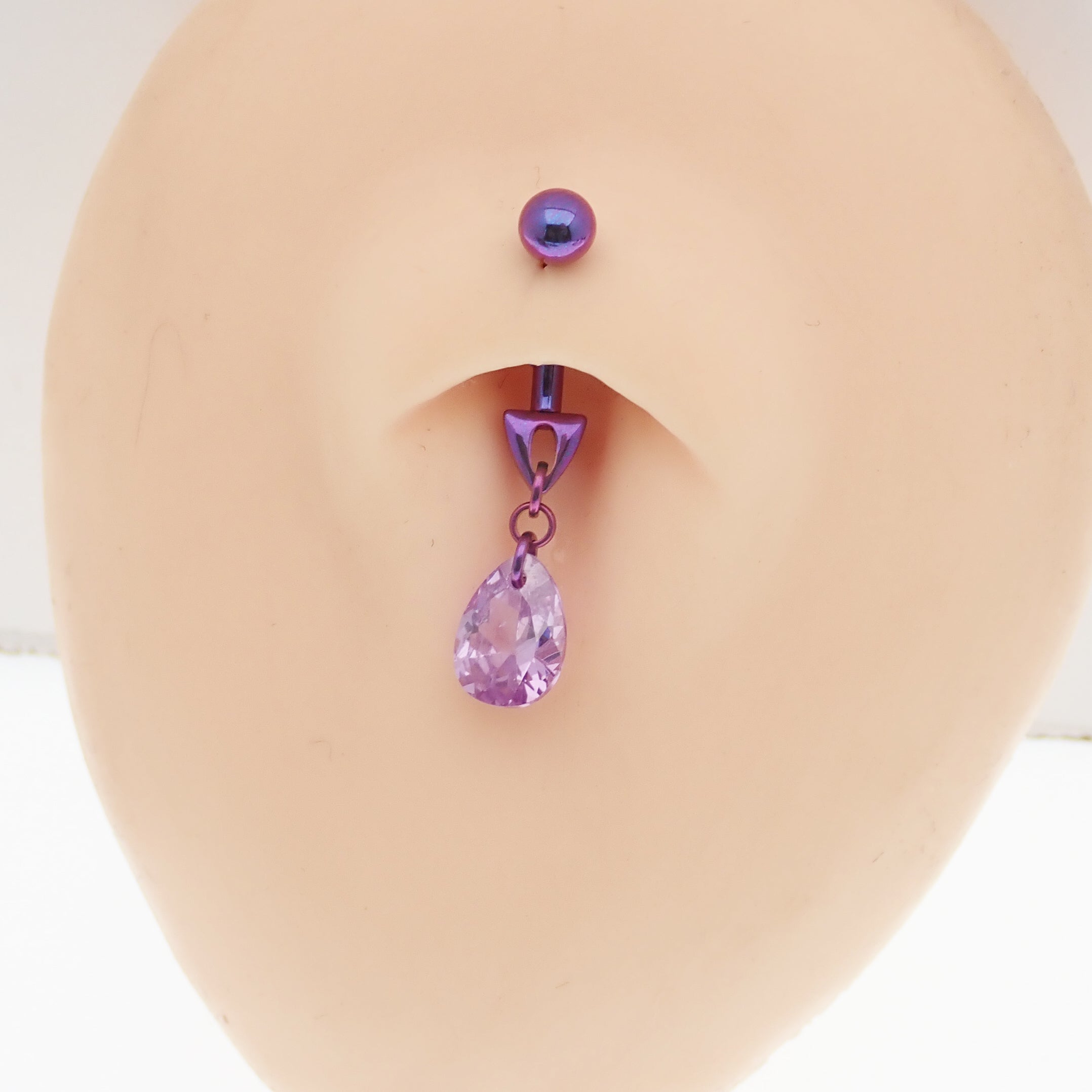 Magpie 14g violet curve bar belly ring with cute dangle design, featuring a curved bar for pierced navel jewelry.