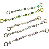 Magpie titanium and cubic zirconia ear cuff chain with emerald accents, 32mm or 38mm add-on piercing jewelry.
